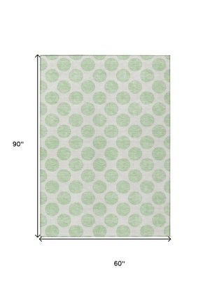 HomeRoots 5' Playful Mint Green and Ivory Polka Dot Area Rug – Durable, Washable Décor for Indoor and Outdoor Spaces 5' X 8' 614918