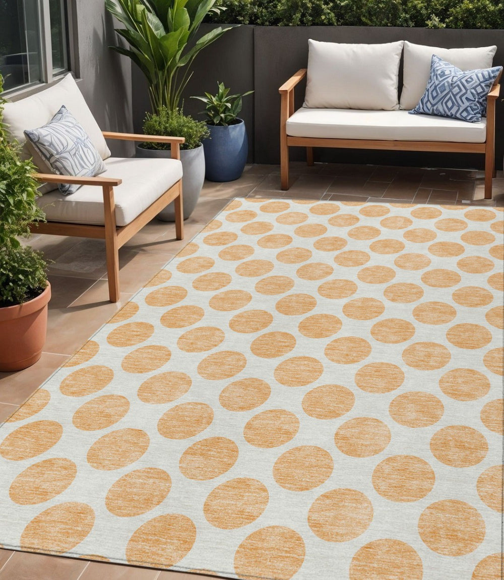 HomeRoots 5' Peach and Ivory Polka Dot Washable Area Rug for Indoor & Outdoor High-Traffic Spaces 5' X 8' 614930