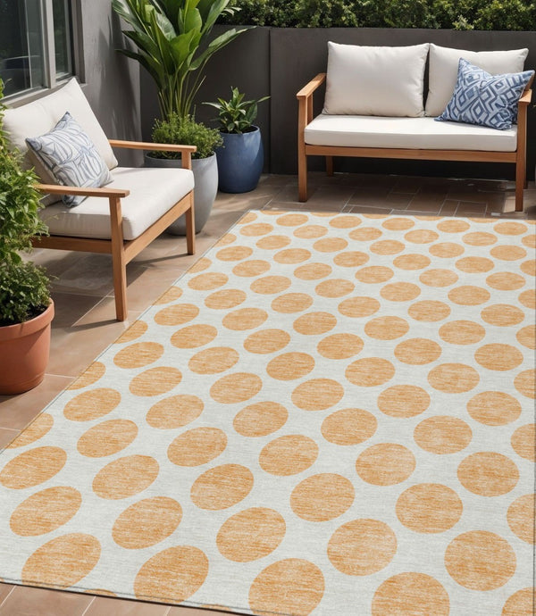 HomeRoots 5' Peach and Ivory Polka Dot Washable Area Rug for Indoor & Outdoor High-Traffic Spaces 5' X 8' 614930