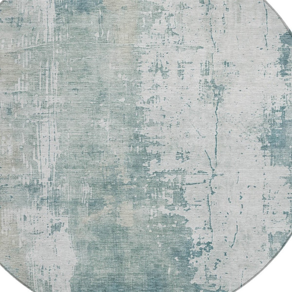 HomeRoots 5' Turquoise and Ivory Abstract Area Rug - Machine Washable, Durable for Indoor and Outdoor Use 8' Round 616204