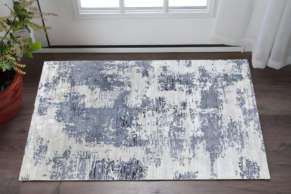 HomeRoots 2' X 3' Blue and Ivory Abstract Hand-Tufted Area Rug - Contemporary Bohemian Charm for Small Spaces 617013