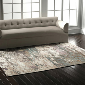 Homeroots 10' X 13' Abstract Distressed Area Rug - Durable, Stain Resistant, Perfect For Homes With Kids & Pets Ivory,Blue,Purple Polypropylene Blend 617068