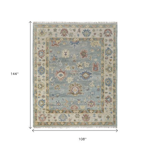 Homeroots 9' Blue Ivory Yellow Floral Hand Knotted Area Rug With Fringe - Stain Resistant, Artisan Crafted Beauty Blue,Ivory,Yellow Wool Blend 617281
