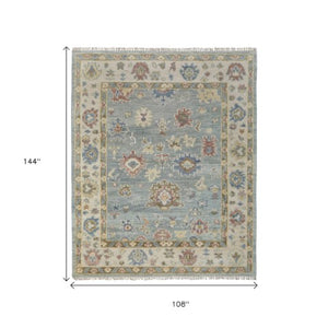 Homeroots 9' Blue Ivory Yellow Floral Hand Knotted Area Rug With Fringe - Stain Resistant, Artisan Crafted Beauty Blue,Ivory,Yellow Wool Blend 617281