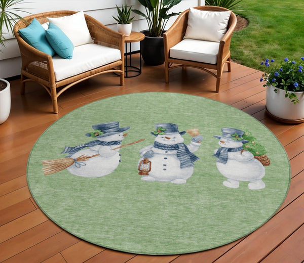 HomeRoots 8' Washable Round Area Rug with Snowmen Motif in Artichoke Green, Denim Blue & Ivory for Indoors & Outdoors 621738