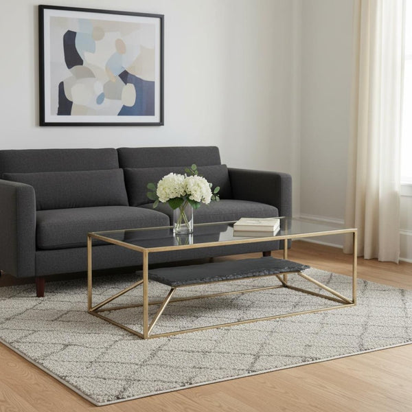 HomeRoots 48" Brass Glass and Iron Pedestal Coffee Table - Elegant Centerpiece for Modern Living Spaces & Offices 623341