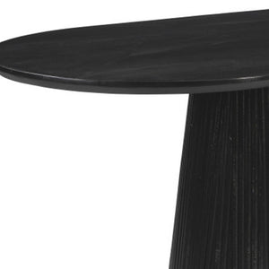 HomeRoots 81" Black Solid Wood Oval Dining Table with Pedestal Base - Modern Design for Dining & Workspaces 623362