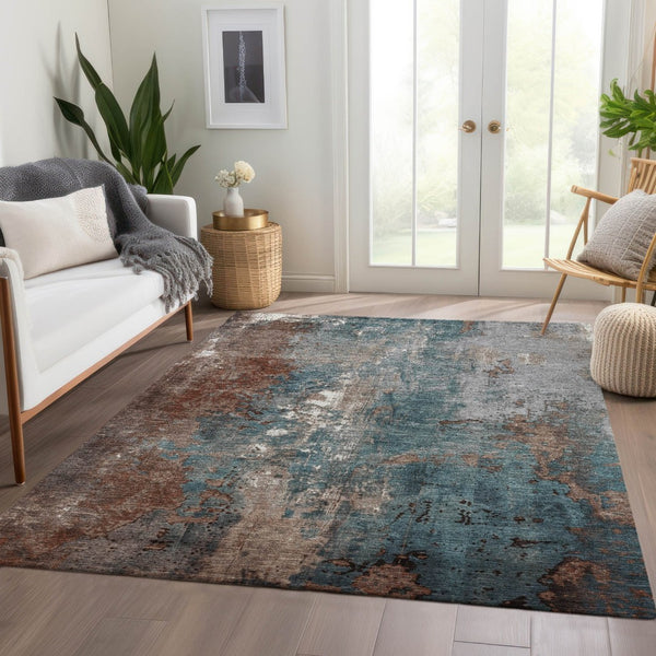 HomeRoots 5' Abstract Rust and Teal Blue Area Rug - Washable, Versatile Indoor/Outdoor Design for Modern Spaces 5' X 8' 623432