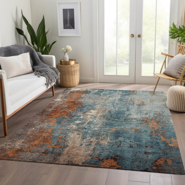 HomeRoots 5' Teal Blue and Copper Abstract Area Rug - Stylish, Washable, Durable Indoor/Outdoor Accent Piece 5' X 8' 623438