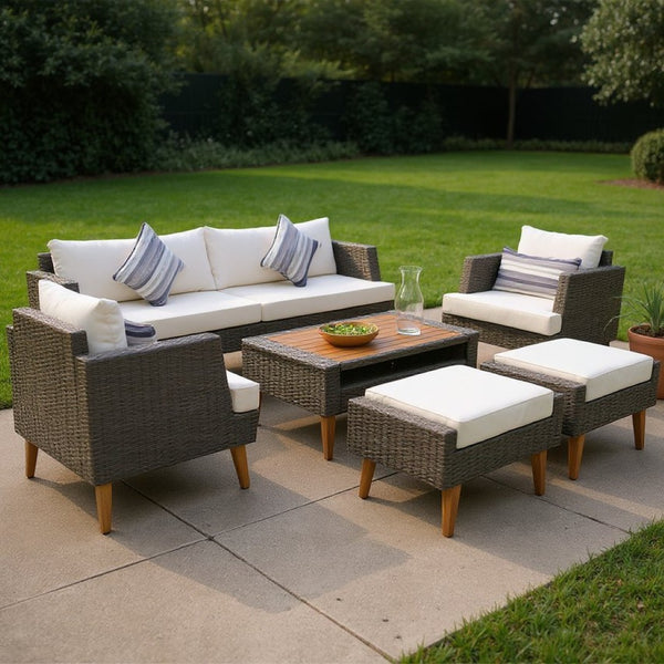 HomeRoots Four-Piece Outdoor Gray Wicker Seating Group with Cushions, Coffee Table & Versatile Comfort Options 625696