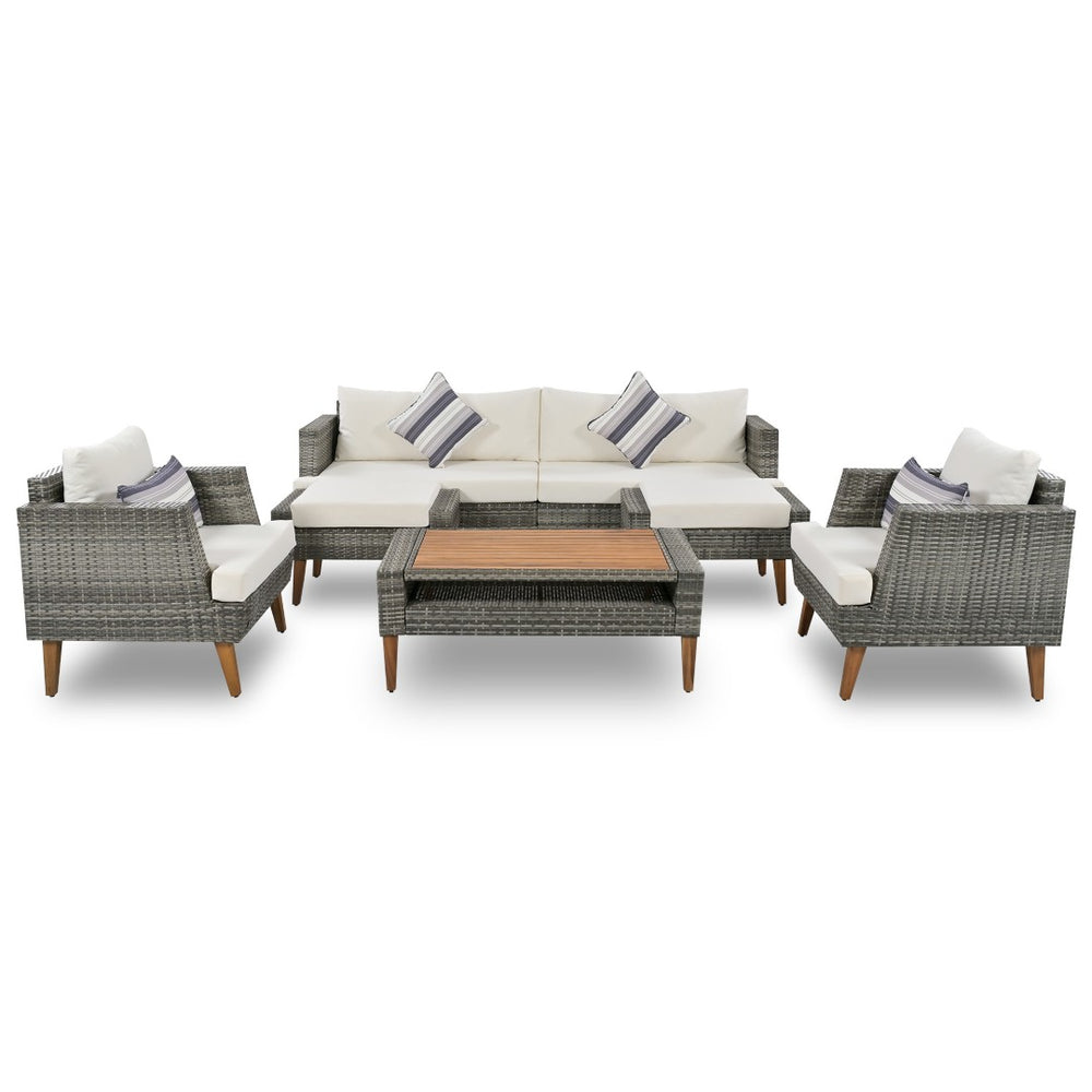 HomeRoots Four-Piece Outdoor Gray Wicker Seating Group with Cushions, Coffee Table & Versatile Comfort Options 625696