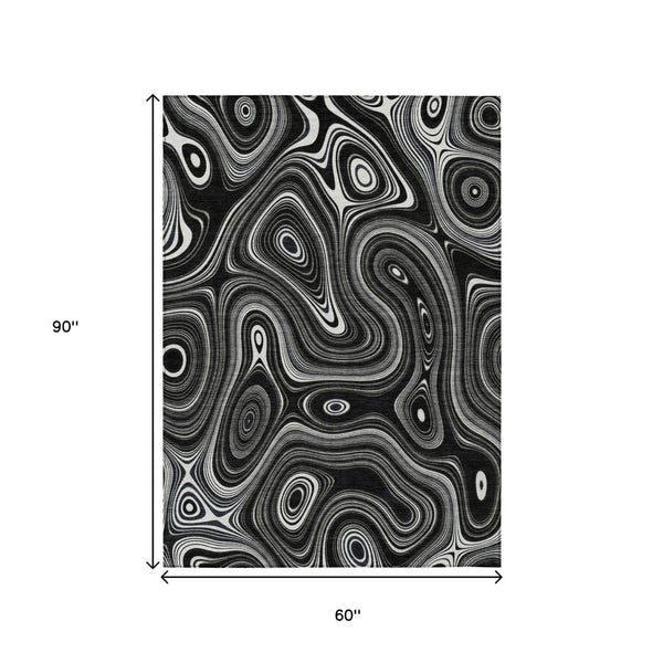 HomeRoots 5' Modern Black and Ivory Geometric Washable Area Rug for Indoor and Outdoor High-Traffic Spaces 5' X 8' 631372