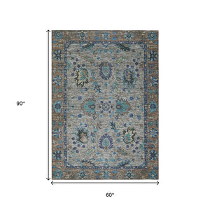 HomeRoots 5' Durable Pewter and Teal Blue Floral Indoor Outdoor Area Rug for Easy Care and Timeless Style 5' X 8' 631648