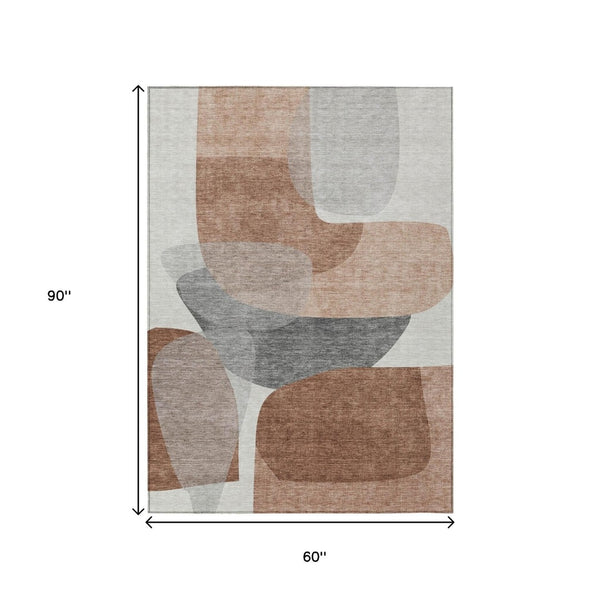 HomeRoots 5' Durable Rust and Gray Abstract Area Rug – Machine Washable for Indoor and Outdoor Spaces 5' X 8' 632174