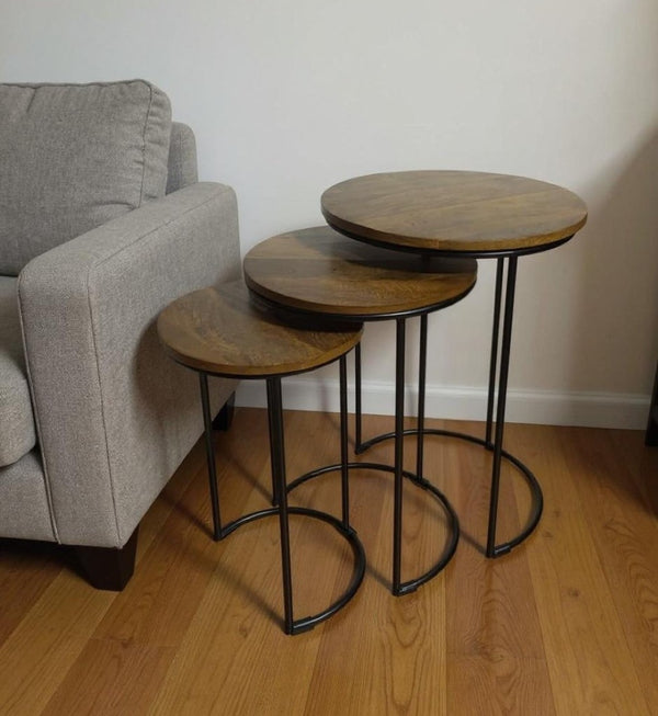 HomeRoots Set of Two Nesting Round Tables with Chestnut Wood Tops & Black Metal Frame for Stylish Living Spaces 632725