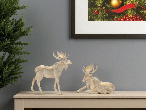 HomeRoots Set of Two Charming Gold and Beige Moose Figurines - Rustic Holiday Decor for Home & Gifts 633822