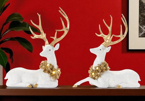 HomeRoots Set of Two Elegant White and Gold Polyresin Deer Figurines with LED Light for Home Decor Charm 633877