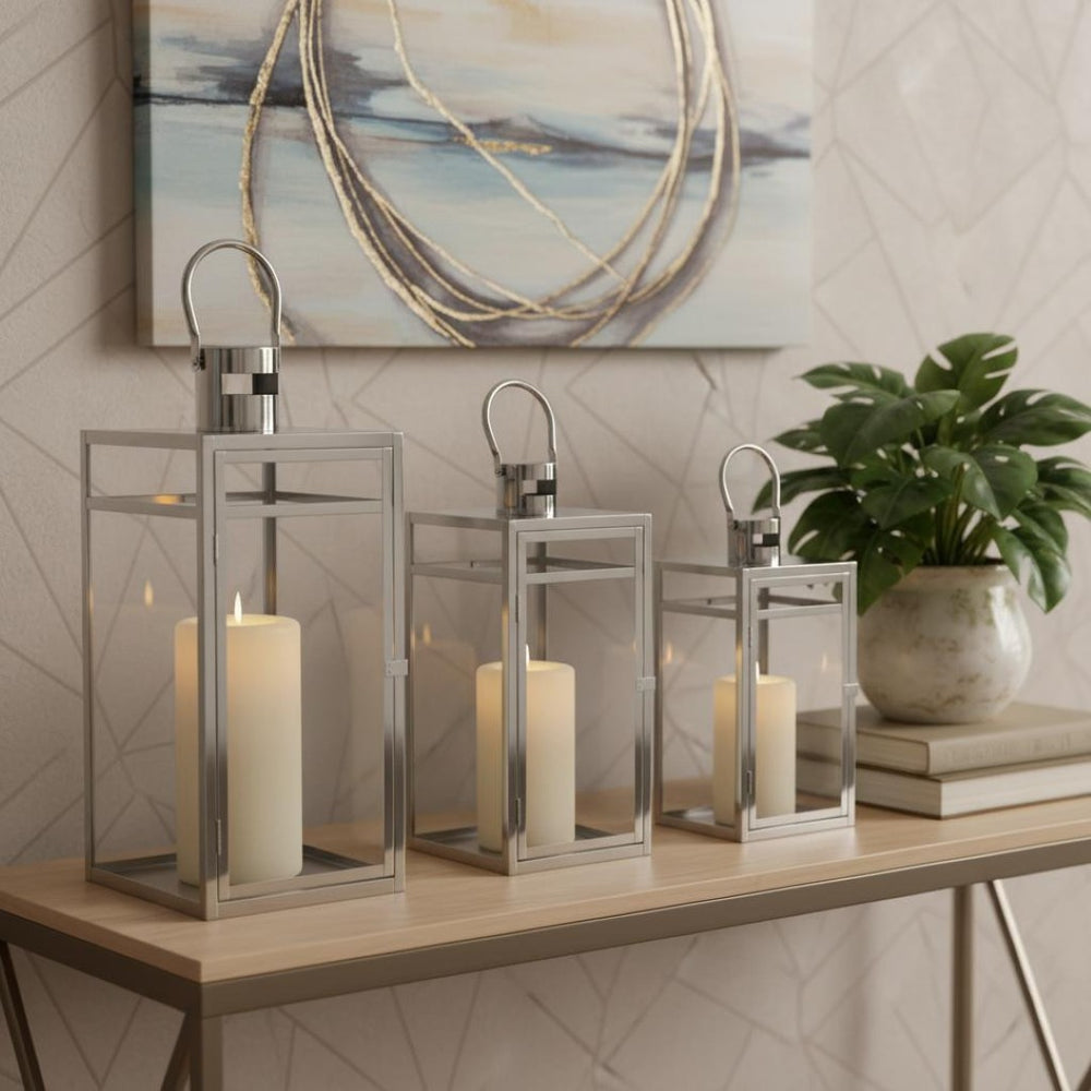 HomeRoots Set of Three Elegant Geometric Stainless Steel & Glass Floor Lanterns - Modern Candle Holders 634852