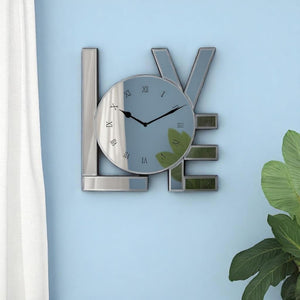 HomeRoots 11" Silver Mirrored Glass Love Wall Clock - Elegant Romance with Classic Roman Numerals & Sparkle Decor 635639