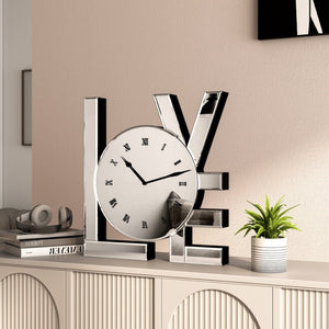 HomeRoots 11" Silver Mirrored Glass Love Wall Clock - Elegant Romance with Classic Roman Numerals & Sparkle Decor 635639