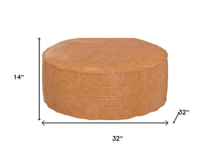 HomeRoots 32" Brown Faux Leather Round Pouf Ottoman - Versatile Bohemian Accent for Footrest, Seating & Decor 638511