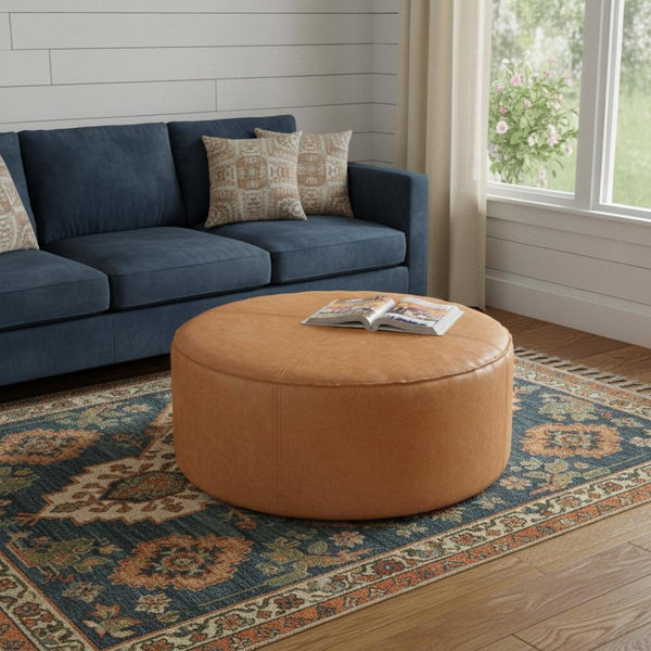 HomeRoots 32" Brown Faux Leather Round Pouf Ottoman - Versatile Bohemian Accent for Footrest, Seating & Decor 638511