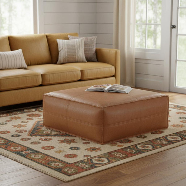 HomeRoots 36" Brown Faux Leather Pouf Ottoman - Versatile Multi-Purpose Accent Piece for Modern Decor & Comfort 638532
