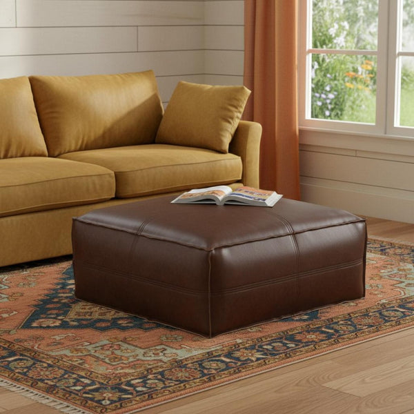 HomeRoots 30" Brown Faux Leather Pouf Ottoman - Versatile Multi-Purpose Footrest and Extra Seating Solution 638536