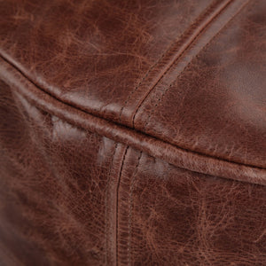 HomeRoots 18" Brown Leather Round Pouf Ottoman - Stylish Footrest & Extra Seating for Modern Home Décor 638571