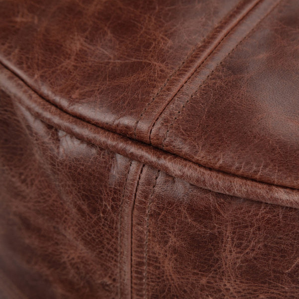 HomeRoots 18" Brown Leather Round Pouf Ottoman - Stylish Footrest & Extra Seating for Modern Home Décor 638571