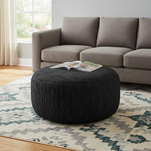 HomeRoots 30" Black Leather Round Pouf Ottoman - Versatile Accent for Seating, Footrest, or Stylish Tabletop Use 638574
