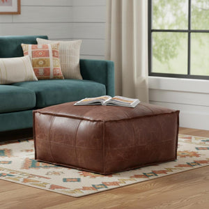 HomeRoots 26" Brown Leather Pouf Ottoman - Stylish Versatile Seating & Footrest for Modern Living Spaces 638575