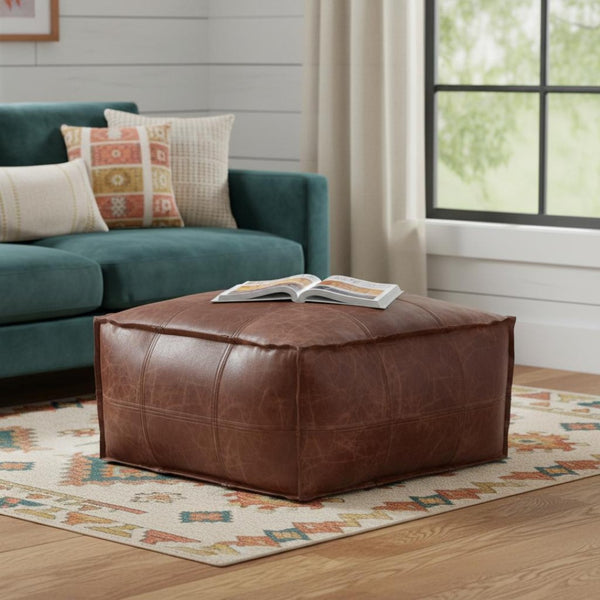 HomeRoots 26" Brown Leather Pouf Ottoman - Stylish Versatile Seating & Footrest for Modern Living Spaces 638575