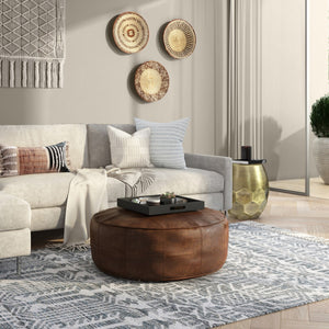 HomeRoots 34" Brown Leather Round Pouf Ottoman - Versatile Footrest, Extra Seating & Stylish Accent for Any Room 638578