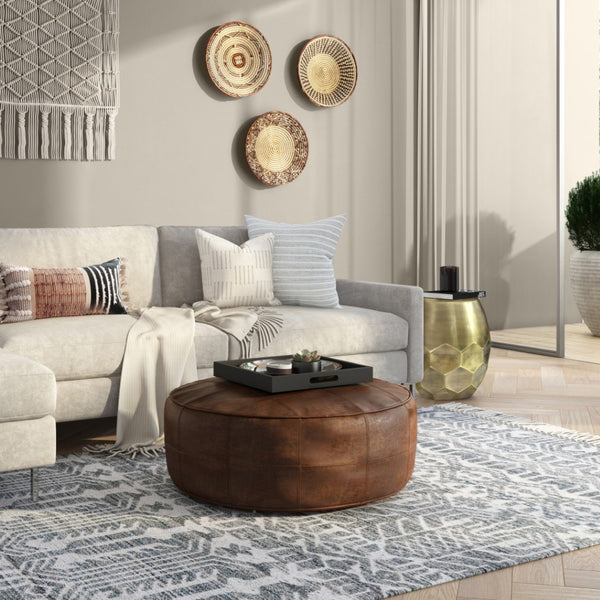 HomeRoots 34" Brown Leather Round Pouf Ottoman - Versatile Footrest, Extra Seating & Stylish Accent for Any Room 638578