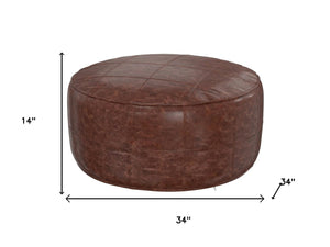 HomeRoots 34" Brown Leather Round Pouf Ottoman - Versatile Footrest, Extra Seating & Stylish Accent for Any Room 638578