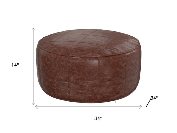 HomeRoots 34" Brown Leather Round Pouf Ottoman - Versatile Footrest, Extra Seating & Stylish Accent for Any Room 638578