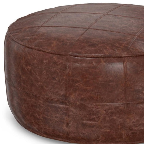 HomeRoots 34" Brown Leather Round Pouf Ottoman - Versatile Footrest, Extra Seating & Stylish Accent for Any Room 638578