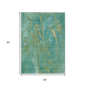 HomeRoots 5' X 8' Teal Blue Gold Botanical Leaves Rug - Stylish, Durable, Machine Washable for Indoor/Outdoor Use 639240