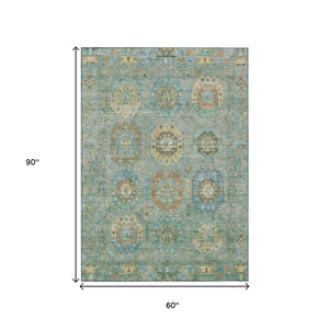 HomeRoots 5' Teal Blue Gold Copper Medallion Washable Area Rug - Durable Indoor/Outdoor Design for Every Space 639432