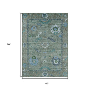 HomeRoots 5' X 8' Washable Floral Medallion Area Rug in Artichoke Green & Denim Blue for Indoor/Outdoor Use 639468