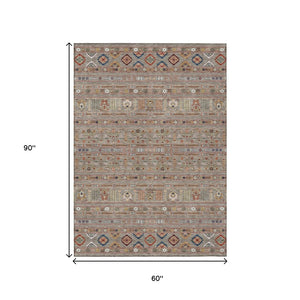 HomeRoots 5' Taupe Blue & Copper Tribal Washable Area Rug - Stylish, Durable, & Easy-Care for Indoor/Outdoor Use 640077