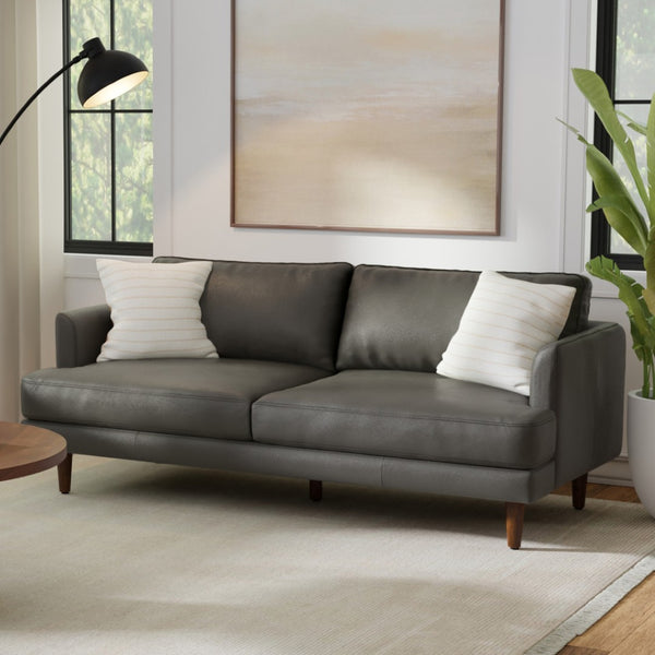 HomeRoots 76" Sleek Black Leather Sofa with Warm Brown Legs - Mid-Century Modern Design for Stylish Comfort 640995