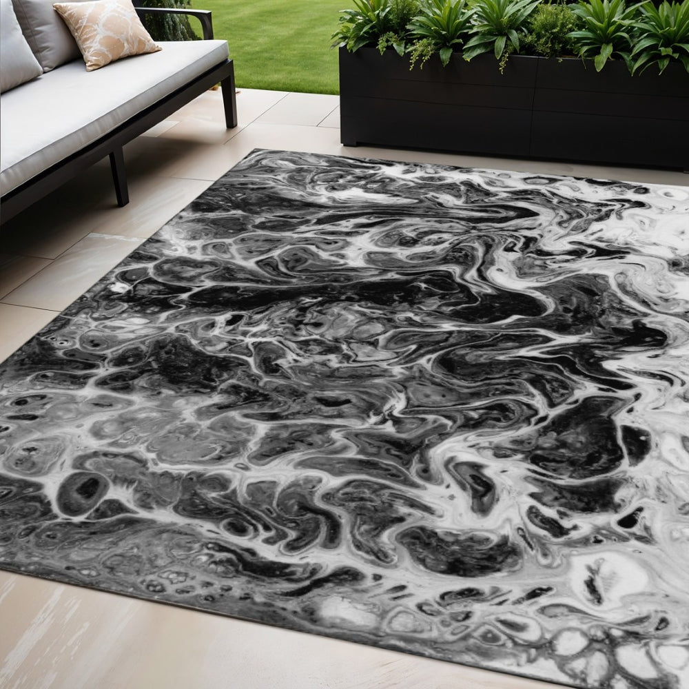 HomeRoots 5' X 8' Black And Ivory Abstract Indoor Outdoor Area Rug - Stylish, Washable, Durable for High-Traffic Spaces 643524