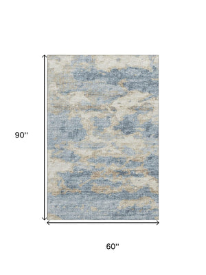 HomeRoots 5' X 8' Abstract Area Rug in Blue, Silver & Gold - Washable, UV-Protected, Stain-Resistant Design 643769