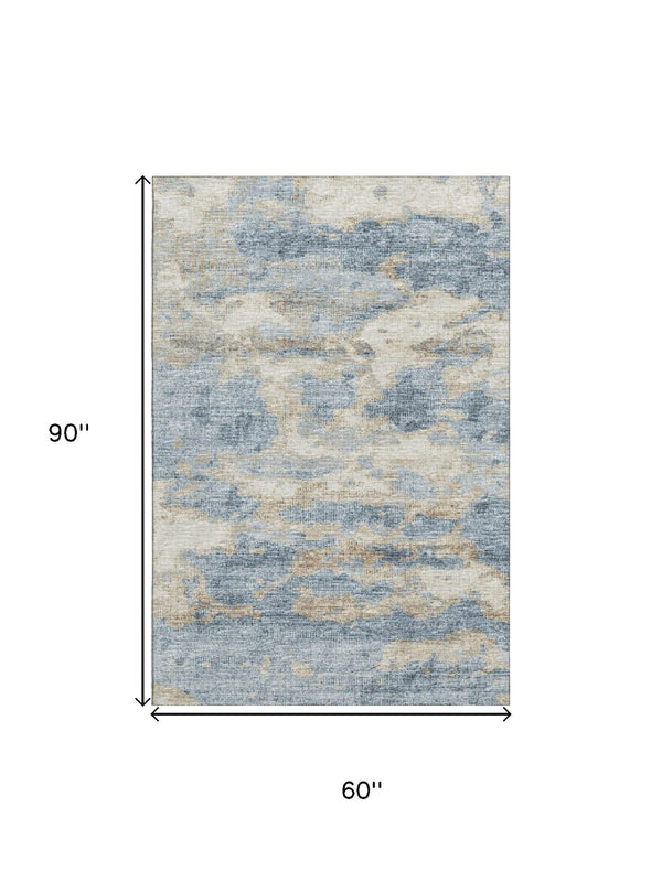 HomeRoots 5' X 8' Abstract Area Rug in Blue, Silver & Gold - Washable, UV-Protected, Stain-Resistant Design 643769