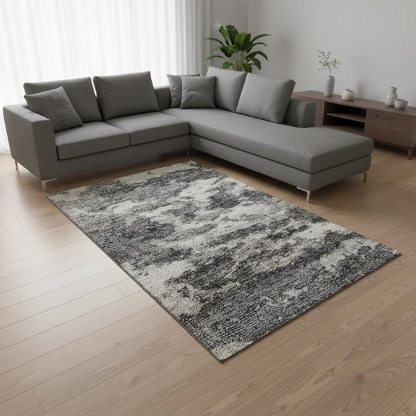 HomeRoots 8' X 10' Black And Ivory Abstract Area Rug - Washable, UV-Protected, Stylish for High-Traffic Spaces 643789
