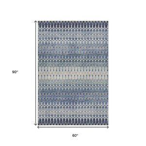 HomeRoots 5' X 8' Aqua Gray and Orange Tribal Area Rug - Washable, UV Protected, Stylish for Indoor & Outdoor Use! 643805