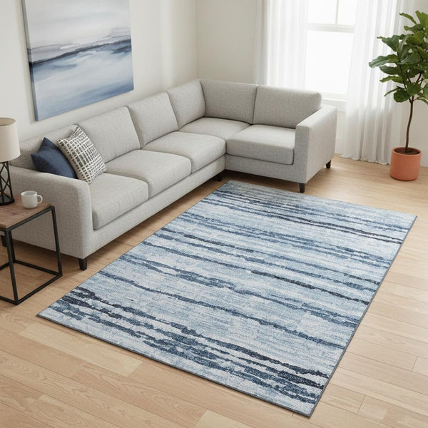 HomeRoots 8' X 10' Blue and Ivory Striped Washable Area Rug with UV Protection for Indoor & Outdoor Spaces 644045