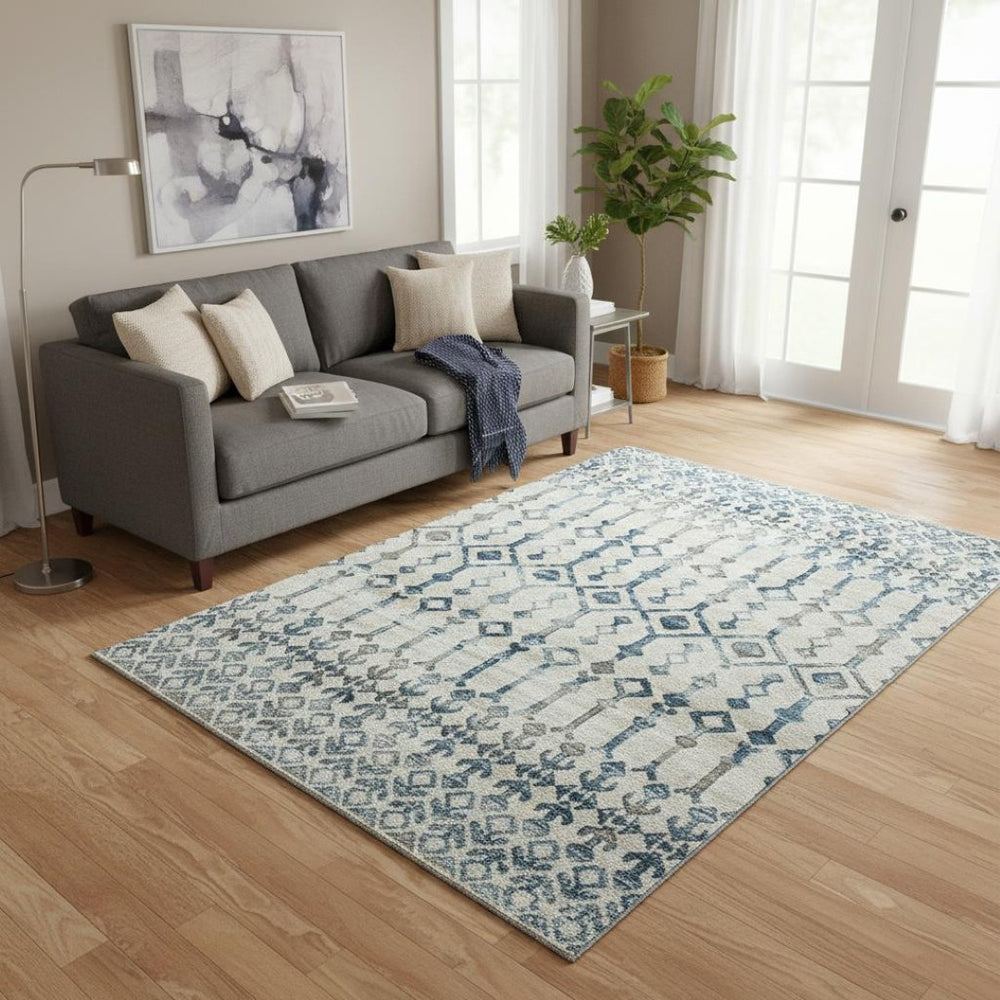 HomeRoots 5' X 8' Ivory and Blue Tribal Washable Area Rug - Durable, Stain-Resistant, UV Protected Design 644140